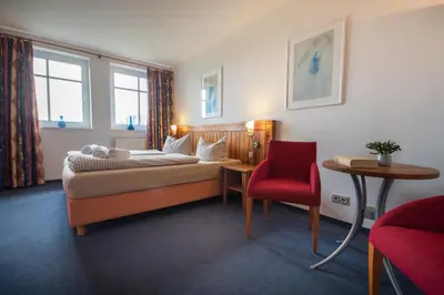 Ein Sitzbereich in der Unterkunft Hotel Nige Hus