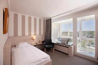 Ein Bett oder Betten in einem Zimmer der Unterkunft Hotel Seelust