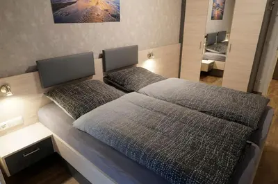 Ein Bett oder Betten in einem Zimmer der Unterkunft Villa Döser Strand