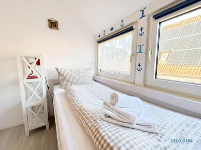 Ein Bett oder Betten in einem Zimmer der Unterkunft Ferienhaus Méhaux 11