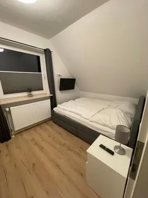 Ein Bett oder Betten in einem Zimmer der Unterkunft Dyke