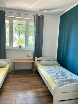 Ein Bett oder Betten in einem Zimmer der Unterkunft Ferienhaus Malte Büsch