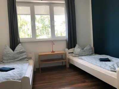 Ein Bett oder Betten in einem Zimmer der Unterkunft Ferienhaus Malte Büsch