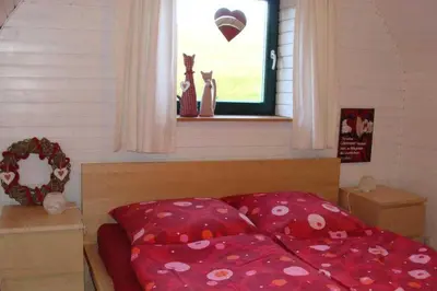 Ein Bett oder Betten in einem Zimmer der Unterkunft Ferienhaus 