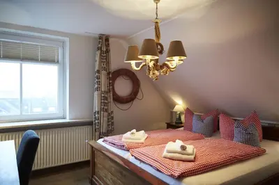 Ein Bett oder Betten in einem Zimmer der Unterkunft Bernstein-Hotel Bootshaus