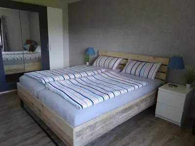 Ein Bett oder Betten in einem Zimmer der Unterkunft Ferienwohnung Schwiemann, Erdgeschoss