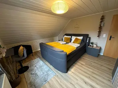Ein Bett oder Betten in einem Zimmer der Unterkunft Ferienwohnung Herrlichkeit