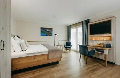 Ein Bett oder Betten in einem Zimmer der Unterkunft Hotel Alter Muschelsaal
