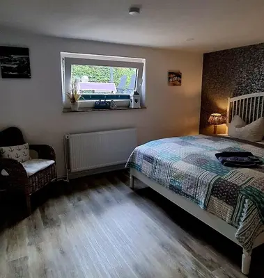 Ein Bett oder Betten in einem Zimmer der Unterkunft FeWoGeestland