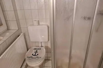 Ein Badezimmer in der Unterkunft Heimathafen