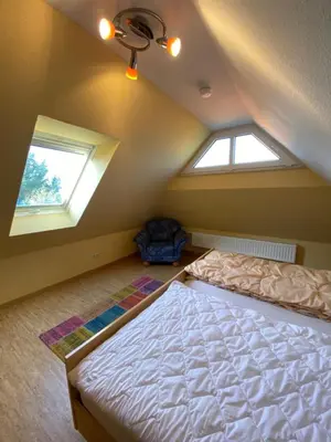 Ein Bett oder Betten in einem Zimmer der Unterkunft Ferienwohnung am Deichweg