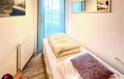 Ein Bett oder Betten in einem Zimmer der Unterkunft Nice Apartment In Friedrichskoog Spitze