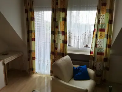 Ein Sitzbereich in der Unterkunft Kleine Krabbe