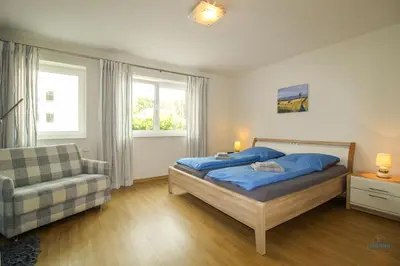 Ein Bett oder Betten in einem Zimmer der Unterkunft Residenz Hohe Lith Wohnung 04 01