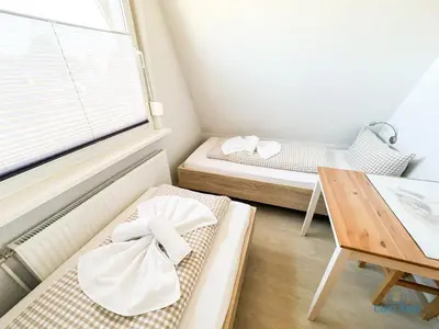Ein Bett oder Betten in einem Zimmer der Unterkunft Ferienhaus am Ringwall 8