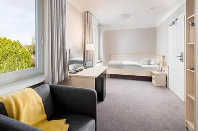 Ein Bett oder Betten in einem Zimmer der Unterkunft Akzent Hotel Dorn