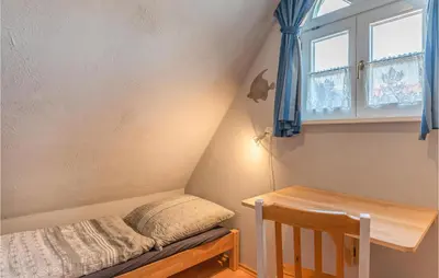 Ein Bett oder Betten in einem Zimmer der Unterkunft Nice Home In Dithmarschen With Wifi