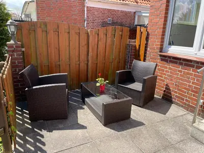 Ein Sitzbereich in der Unterkunft Lust auf Meer - Appartement Ferienwohnung Terrasse kleine Hunde willkommen Nähe Nordsee