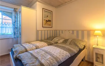 Ein Bett oder Betten in einem Zimmer der Unterkunft Beautiful Apartment In Friedrichskoog