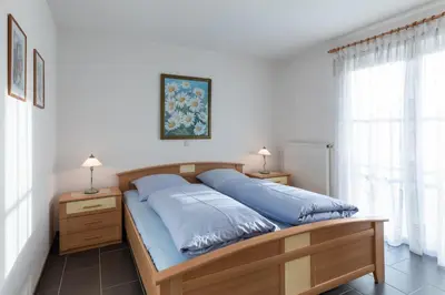 Ein Bett oder Betten in einem Zimmer der Unterkunft Haus Seewind Wohnung 4
