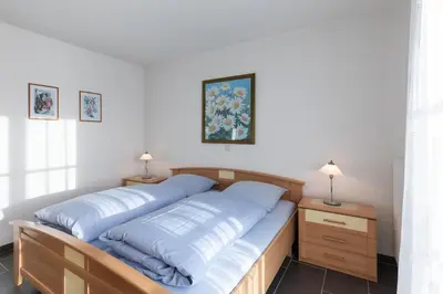 Ein Bett oder Betten in einem Zimmer der Unterkunft Haus Seewind Wohnung 4
