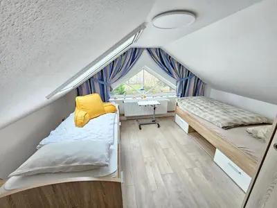 Ein Bett oder Betten in einem Zimmer der Unterkunft Appartmenthaus Nordlicht