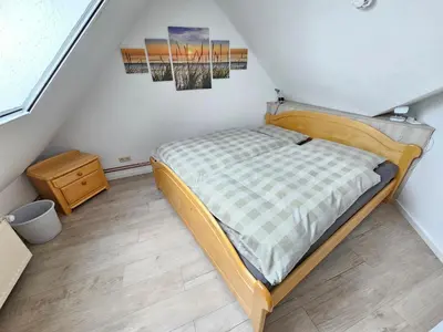 Ein Bett oder Betten in einem Zimmer der Unterkunft Appartmenthaus Nordlicht