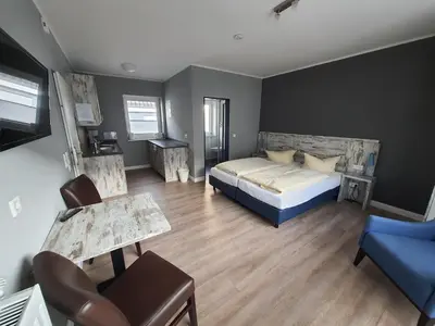 Ein Bett oder Betten in einem Zimmer der Unterkunft Landhaus Braband Studios - Rugenbargsweg 17