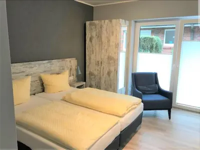 Ein Bett oder Betten in einem Zimmer der Unterkunft Landhaus Braband Studios - Rugenbargsweg 17
