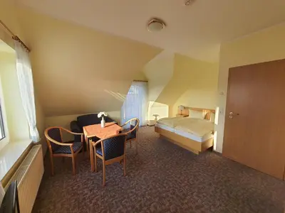 Ein Bett oder Betten in einem Zimmer der Unterkunft Landhaus Braband Ferienwohnungen - Gustav-Schönleber-Weg 27
