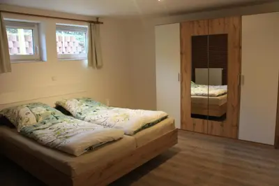 Ein Bett oder Betten in einem Zimmer der Unterkunft Ferienhaus Buchenblick