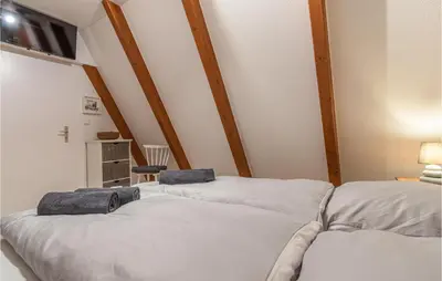 Ein Bett oder Betten in einem Zimmer der Unterkunft Stunning Home In Friedrichskoog