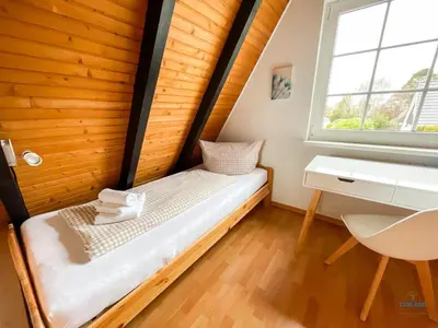 Ein Bett oder Betten in einem Zimmer der Unterkunft Ferienhaus Christian Brütt Weg 23