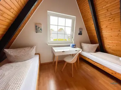 Ein Bett oder Betten in einem Zimmer der Unterkunft Ferienhaus Christian Brütt Weg 23
