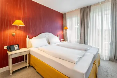 Ein Bett oder Betten in einem Zimmer der Unterkunft Romantik Hotel Bösehof