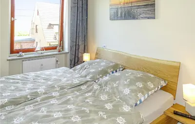 Ein Bett oder Betten in einem Zimmer der Unterkunft Lovely Apartment In Büsum With Kitchen