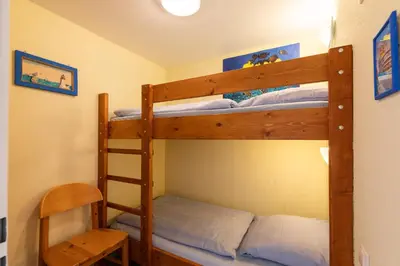 Ein Bett oder Betten in einem Zimmer der Unterkunft Knechtsand 412