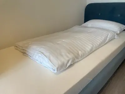 Ein Bett oder Betten in einem Zimmer der Unterkunft Seehotel Geestland