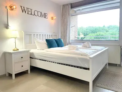 Ein Bett oder Betten in einem Zimmer der Unterkunft Haus Frauenpreiss FeWo 404