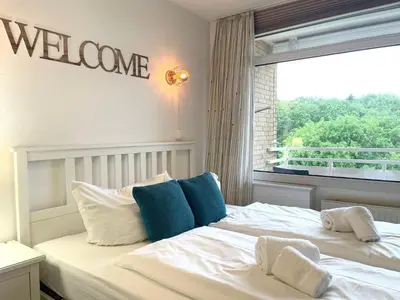 Ein Bett oder Betten in einem Zimmer der Unterkunft Haus Frauenpreiss FeWo 404