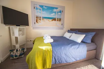 Ein Bett oder Betten in einem Zimmer der Unterkunft Studio-Apartment Nr. 59 im strandnahen Haus Frauenpreiss