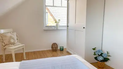 Ein Bett oder Betten in einem Zimmer der Unterkunft Haus Eversand 2