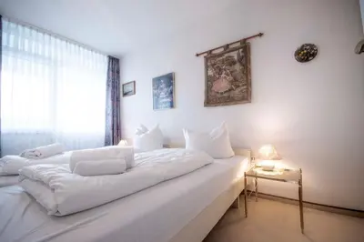 Ein Bett oder Betten in einem Zimmer der Unterkunft Strandnahe Ferienwohnung FB12.01