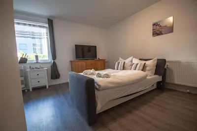 Ein Bett oder Betten in einem Zimmer der Unterkunft Neue Reihe 8 rechts