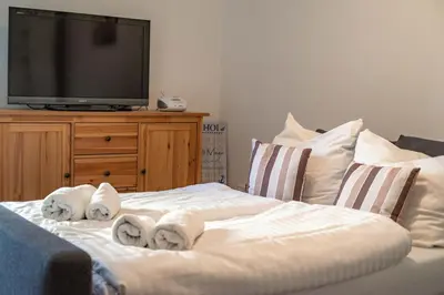 Ein Bett oder Betten in einem Zimmer der Unterkunft Neue Reihe 8 rechts
