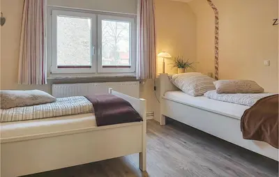 Ein Bett oder Betten in einem Zimmer der Unterkunft Lovely Home In Wurster Nordseeküste