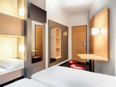 Ein Bett oder Betten in einem Zimmer der Unterkunft B&B Hotel Cuxhaven