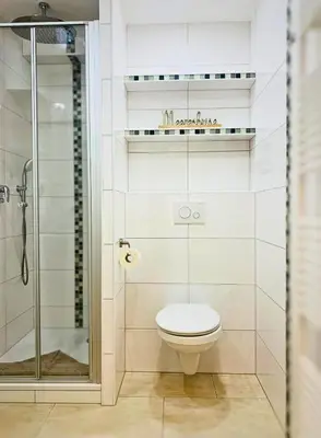 Ein Badezimmer in der Unterkunft Duhnentraum Balkon mit Meerblick & Top Lage, Parken, Wlan, Bettwäsche inklusive