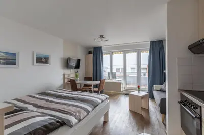 Ein Bett oder Betten in einem Zimmer der Unterkunft Knechtsand 455