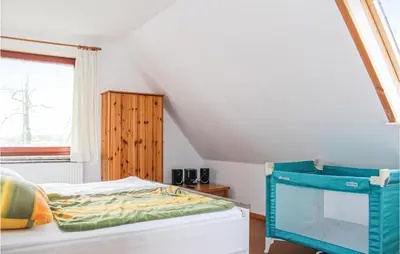 Ein Bett oder Betten in einem Zimmer der Unterkunft Cozy Apartment In Wurster Nordseeküste